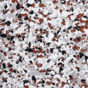 Epoxy floor flake sample featuring a blend of red, black, and white flakes, showcasing durability and aesthetic appeal for Pristine Epoxy flooring solutions.