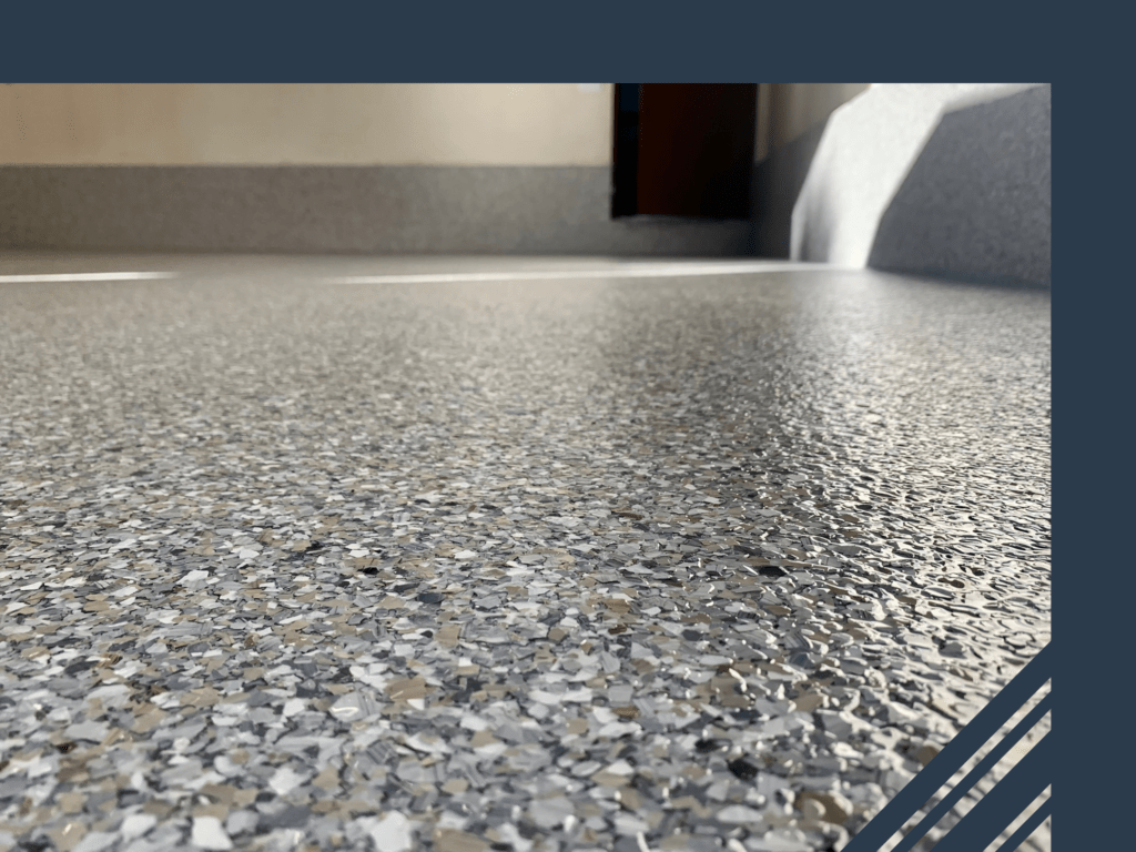Epoxy floor with a glossy finish showcasing decorative flakes, enhancing brightness and cleanliness in a residential or commercial space.
