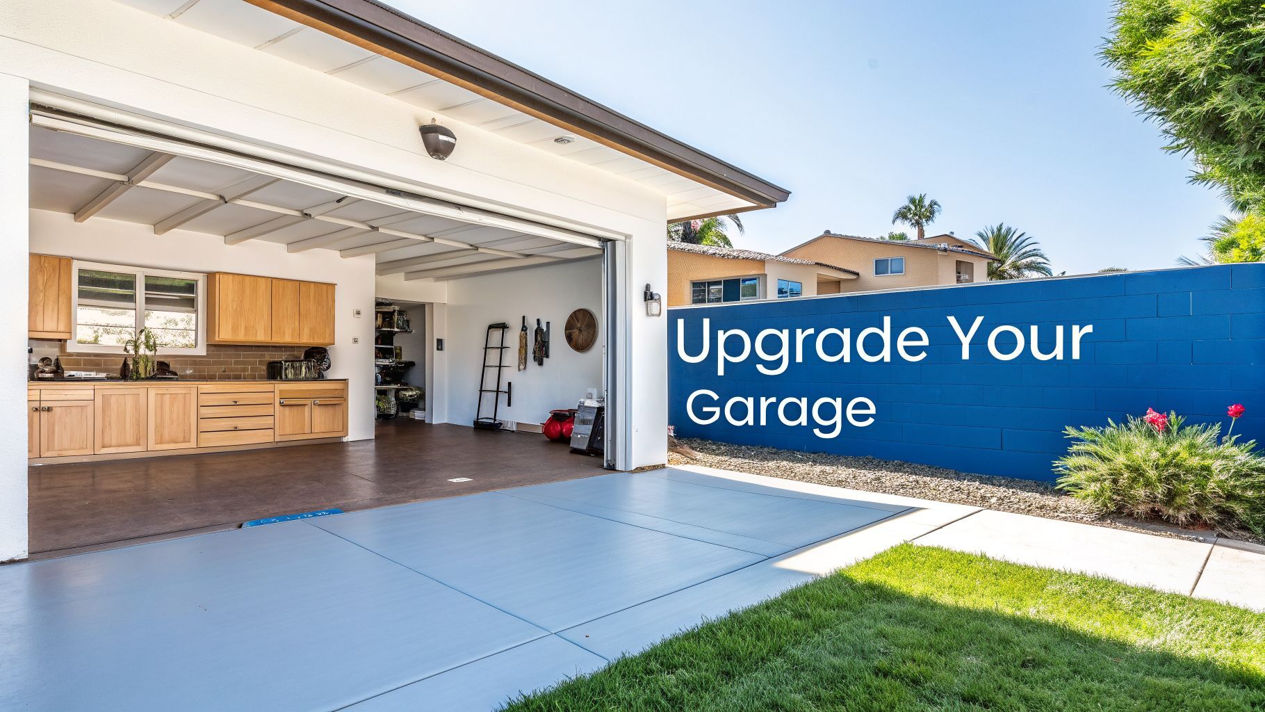 Upgraded garage with professional floor coating, modern cabinetry, and vibrant blue accent wall featuring "Upgrade Your Garage" text, showcasing a clean and functional space in San Diego.