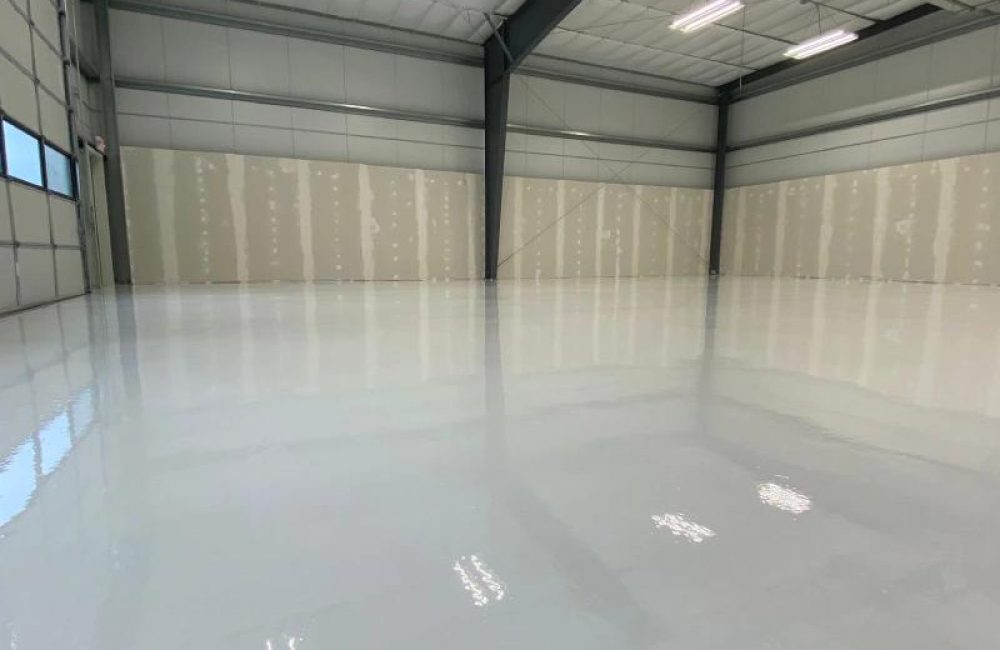 Seamless, glossy epoxy flooring in a commercial space, showcasing a durable finish ideal for residential and garage applications in Carmel Valley, CA.