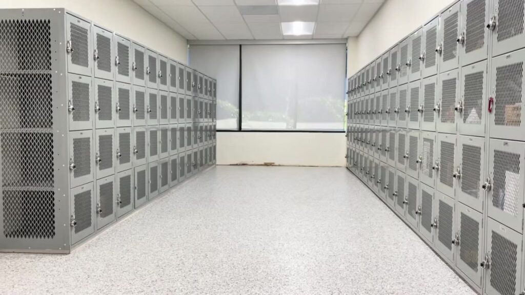 Lockers in a clean, well-lit room with a seamless epoxy floor, showcasing a durable and easy-to-maintain surface ideal for commercial spaces.