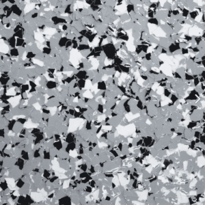 Epoxy floor flake sample featuring a blend of black, white, and grey flakes, showcasing durability and aesthetic appeal for residential and commercial spaces.