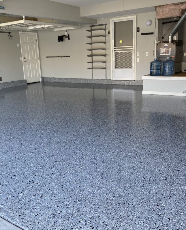 Well-designed San Diego garage with organized storage and stylish epoxy flooring.